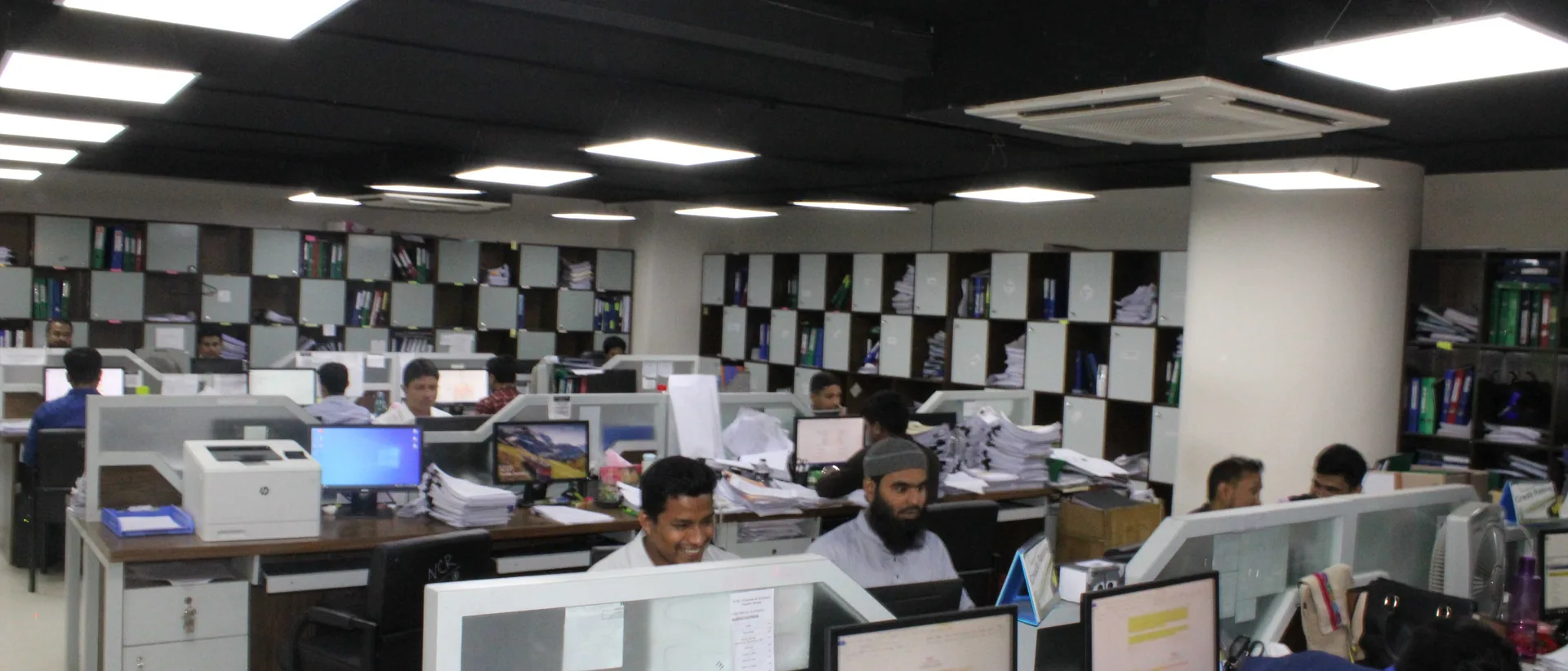 Analysts at work on the National Credit Ratings floor in Dhaka